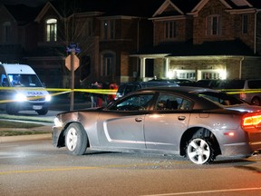 This silver Dodge Charger was shot at Tuesday night. (DAVID RITCHIE/Special to the Toronto Sun)