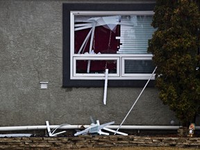 Police are on scene at a Hell's Angels house on 81 Avenue and 159 Street in Edmonton, Alta., on Wednesday, April 23, 2014. Ten search warrants were executed by Alberta Law Enforcement Response Teams as part of an ongoing investigation into the motorcycle club. Codie McLachlan/Edmonton Sun