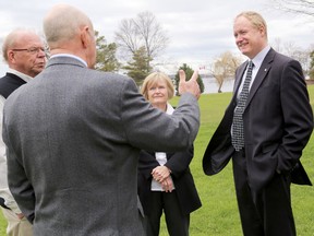 Dr. Colin Carrie, Member of Parliament for Oshawa and Parliamentary Secretary to the Minister of the Environment, right, speaks to Northumberland-Quinte West MP Rick Norlock, Glenda Rodgers of Lower Trent Conservation and Terry Murphy of Quinte Conservation, Wednesday at the Bay of Quinte Golf Club. 
Emily Mountney/The Intelligencer