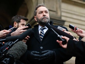 New Democratic Party leader Thomas Mulcair listens to a question during a news conference in Ottawa April 23, 2014. (REUTERS/Chris Wattie)