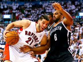 The Raptors' Greivis Vasquez tries to get around Brooklyn's Alan Anderson during Game 2 of their playoff series. (Dave Abel/Toronto Sun)