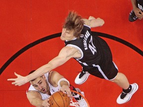 Jonas Valanciunas of the Raptors dunks on Nets’ Andrei Kirilenko during Game 2 on Tuesday at the Air Canada Centre. Big V is playing better than even the Vegas bookmakers predicted. (Dave Abel, Toronto Sun)