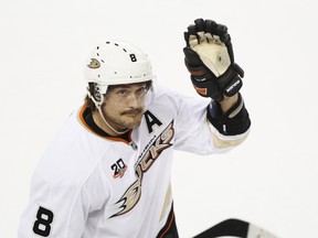 Teemu Selanne of the Anaheim Ducks waves to the crowd after a video tribute during NHL action against the Calgary Flames in Calgary, Alta. on Wednesday March 26, 2014. (QMI Agency file photo)
