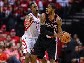 Portland Trail Blazers forward LaMarcus Aldridge controls the ball as Houston Rockets centre Dwight Howard defends during Game 2 of their Western Conference quarterfinal series at the Toyota Center in Houston, April 23, 2014. (TROY TAORMINA/USA Today)
