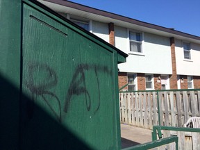 Ottawa police are investigating why gunshots were fired into the rear window of a housing unit at 139 Beausoliel Ave., on Wednesday night. A shed at the back of the property has the word 'Rat" spraypainted on it. (TONY CALDWELL Ottawa Sun)