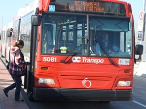 The slogan 'We Go Together' appears on the front of an OC Transpo bus Thursday morning at Fallowfield Station. In September, a few hundred meters away, 6 people died when an OC bus slammed into a train. Some riders have found the slogan to be in bad taste. (DOUG HEMPSTEAD Ottawa Sun)