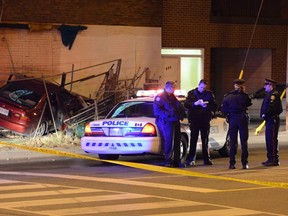 Toronto Police investigate after a brief chase ended a crash near Bloor St. and Parkside Dr. (ANDREW COLLINS/Special to the Toronto Sun)