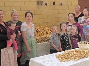 Volunteers baked 2,700 large breads and 550 small ones at the Spirit and Life Centre on April 23 in preparation for the annual Festa della Madonna delle Grazie. From left are Jenn Hemming ( holding daughter Savanah), Nicole and Rosa Sullo, Anthony, Natalie and Samantha Lachapelle, Carmella Lachapelle, Erica Lachapelle, Stephanie Woodall (holding daughter Aubrey) and Reno Lachapelle.