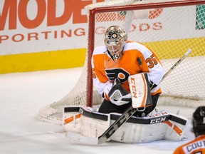 Philadelphia Flyers goalie Steve Mason (35) makes a save against the Pittsburgh Penguins during the second period at Wells Fargo Center on Mar 15, 2014 in Philadelphia, PA, USA. (Eric Hartline/USA TODAY Sports)
