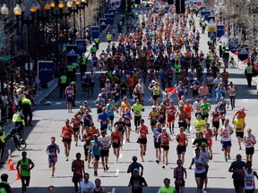 Runners approach the finish line of the 118th Boston Marathon on April 21, 2014 in Boston, Massachusetts.