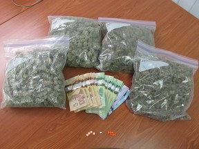After a traffic stop on a 2000 Chrysler Intrepid on Highway 2 in the RM of Victoria April 20, RCMP seized 976 grams of marijuana, morphine pills and clonazepam pills with no prescription, and a bunch of cash.