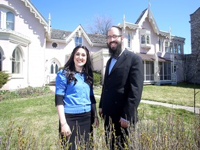 Rabbi Sruly Simon and his wife Esti Simon of the Chabad Student Centre of Kingston outside the former Elizabeth Cottage on Thursday. 
IAN MACALPINE/KINGSTON WHIG-STANDARD/QMI AGENCY