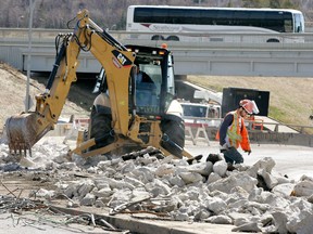 FILE: Danny Hood with DeFord Contracting Inc., walks through the rubble as crews worked on removing concrete and metal rebar on the south side of the Low Level bridge at 99 A St., and Scona Road., on Friday April 29, 2011 in Edmonton. Work Scona Road has been reduced to one lane in each direction as crews have begin the major roadwork that is planned. The complete closure of Scona Road starts May 7th until November 2011.  On May 7th until November, Scona Road will be fully closed, and 99 Street from 81 Avenue to Saskatchewan Drive will be subject to periodic lane reductions. Bus routes into downtown Edmonton will also be effected. TOM BRAID/EDMONTON SUN