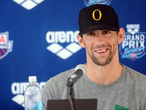 Michael Phelps addresses the media after the men's 100m butterfly race at the 2014 USA Swimming Grand Prix Series in Mesa, Ariz., on Thursday, April 24, 2014. (Joe Camporeale-USA TODAY Sports