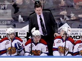 Derek Laxdal talks to a player behind the bench during a playoff game against the Medicine Hat Tigers. (David Bloom, Edmonton Sun)