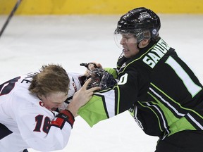 Henrik Samuelsson (10) punches Lethbridge centre Reid Duke when the Edmonton Oil Kings played the Lethbridge Hurricanes at Rexall Place on Monday, Feb. 17, 2014. While Samuelsson hasn't dropped gloves with fellow American Mile Koules, the pair have put their friendship on hold until the Kings and the Medicine Hat Tigers finish the 2013-14 WHL East finals. Ian Kucerak/Edmonton Sun/QMI Agency