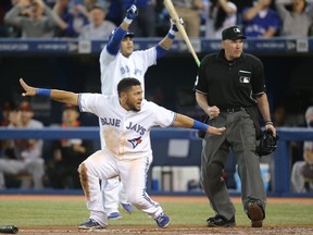 Melky Cabrera of the Toronto Blue Jays reacts after being thrown out at home plate in the first inning during MLB action against the Baltimore Orioles on April 24, 2014 at Rogers Centre. (Tom Szczerbowski/Getty Images/AFP)