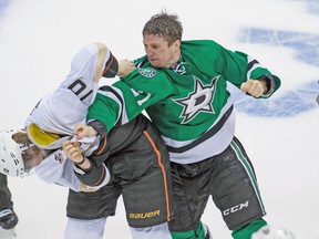 Dallas Stars left wing Antoine Roussel fights Anaheim Ducks forward Corey Perry during Game 4 of their series on Wednesday night. (USA TODAY SPORTS)