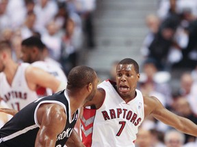 Raptors' Kyle Lowry battles Net's Alan Anderson on Friday night in Game 3 of their series. (Veronica Henri/Toronto Sun)