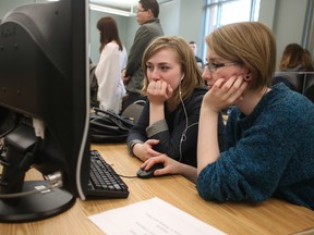 University of Alberta students LeeAnne Johnstone, right, and Alexa Guse test out a computer game at the 6th annual CMPUT 250 Game Development Awards at the U of A Computing Science Centre on Thursday. Awards were handed out in five categories. (TREVOR ROBB/EDMONTON SUN)
