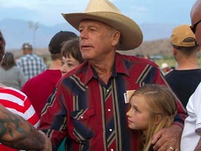 Rancher Cliven Bundy (C) greets supporters during a Bundy family "Patriot Party" near Bunkerville, Nevada, April 18, 2014. His granddaughter Jerusha Bundy, 10, is at right.  REUTERS/Steve Marcus