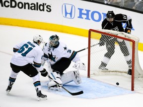 Los Angeles Kings right wing Justin Williams scores a goal on San Jose Sharks goalie Antti Niemi during Game 4 of their Western Conference quarterfinal series at the Staples Center in Los Angeles, April 24, 2014. (KELVIN KUO/USA Today)