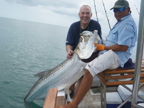 Chief Bill Blair, left, relaxes while on vacation in Costa Rica.