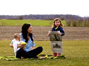 Tara Jeffrey and her daughters Avery, 2, and Hallie, 6 months, enjoy some time outdoors at their St. Clair Township farm. After eight years with The Observer, Jeffrey is bidding farewell to journalism, for now. (Submitted photo)