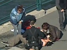 Passersby plucked a man from the frigid waters of the St. Lawrence River after his canoe capsized near the Montreal suburb of Longueuil.
(Screengrab from video)