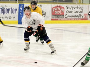 Zach Mackay (left) looks to hit a teammate with a pass during Spring Camp action at the Grant Fuhr Arena over the Easter weekend. - Gord Montgomery, Reporter/Examiner