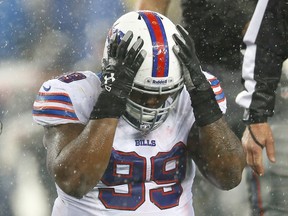Marcell Dareus of the Buffalo Bills reacts after committing a penalty in the second half against the New England Patriots on December 29, 2013. (Jared Wickerham/Getty Images/AFP)