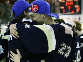 Carson Samoridny (right) and goalie Kenny Cameron, shown here celebrating after their AJHL championship series sweep of the Drumheller Dragons, know they have lots on their plate this coming week at the Western Canada Cup. - Gord Montgomery, Reporter/Examiner