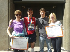 Dave Caraher (in red) poses with his wife Kelly, son Brendan, and daughter Sarah after completing his 2nd Boston Marathon on Monday. SUBMITTED PHOTO