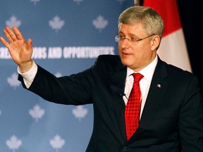 Canada's Prime Minister Stephen Harper gestures after speaking during a moderated question and answer session.

REUTERS/Aaron Harris