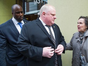 TCHC resident Bonnie Booth talks with Toronto Mayor Rob Ford as he leaves the public housing corporation's headquarters  on April 25, 2014. (Ernest Doroszuk/Toronto Sun)