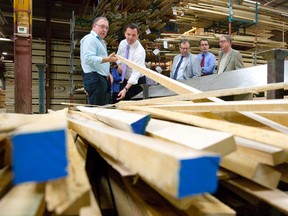 PC leader Tim Hudak talks with general manager Jim Allan as he tours County Heritage Forest Products in London on Friday. CRAIG GLOVER/The London Free Press/QMI Agency