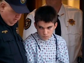 A still image from video footage courtesy WPXI-TV shows stabbing suspect Alex Hribal dressed in a hospital gown after his arraignment with Sheriff's deputies in Export, Pennsylvania.

REUTERS/WPXI-TV