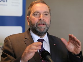 Federal NDP Leader Thomas Mulcair reacts to a Supreme Court of Canada decision that rejected the Conservative government's plans to reform the senate on Friday in Kingston.
ELLIOT FERGUSON/KINGSTON WHIG-STANDARD/QMI AGENCY