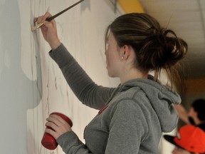 Portage students begin work on community mural projects Friday. (Kevin Hirschfield/THE GRAPHIC)