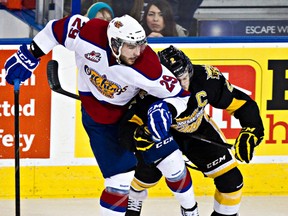 Mitch Moroz, shown here tangling with Brandon's Ryan Pulock in the second round of playoffs, dropped the gloves at the beginning of the Oil KIngs latest game in Medicine Hat. (Codie McLachlan, Edmonton Sun)