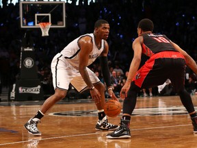 Brooklyn Nets guard Joe Johnson looks to drive around Toronto Raptors guard DeMar DeRozan (10) during the fourth quarter of Game 3 on April 25. (Anthony Gruppuso-USA TODAY Sports)