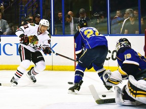 Chicago Blackhawks right wing Marian Hossa takes a shot as St. Louis Blues defenceman Kevin Shattenkirk defends during Game 5 of their Western Conference quarterfinal series at the Scottrade Center in St. Louis, April 25, 2014. (SCOTT ROVAK/USA Today)