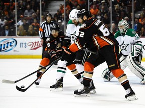 Dallas Stars defenceman Jordie Benn and Anaheim Ducks right wing Teemu Selanne (left) and left wing Pat Maroon battle for the puck during Game 5 of their Western Conference quarterfinal series at the Honda Center in Anaheim, April 25, 2014. (KELVIN KUO/USA Today)