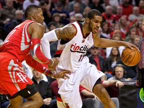 Portland Trail Blazers forward LaMarcus Aldridge drives past Houston Rockets centre Dwight Howard during Game 3 of their Western Conference quarterfinal series at the Moda Center in Portland, April 25, 2014. (CRAIG MITCHELLDYER/USA Today)