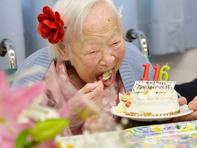 Japanese Misao Okawa, the world's oldest woman, eats her birthday cake as she celebrates her 116th birthday in Osaka, western Japan, in this photo taken by Kyodo March 5, 2014. (REUTERS/Kyodo)