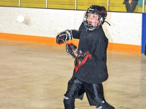 Jaxon Slocombe, 12, prepares to receive a pass during a drill Saturday at the Vulcan District Arena. The Vulcan Vikings play their first games next Saturday, May 3 at home.