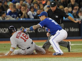 Boston Red Sox right fielder Shane Victorino (18) slides safely into third base under the tag of Toronto Blue Jays' Brett Lawrie during the third inning at Rogers Centre Saturday. (Dan Hamilton/USA TODAY Sports)
