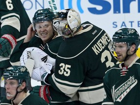 Minnesota Wild forward Mikael Granlund (left) celebrates with goalie Darcy Kuemper following Game 3 of their series with the Colorado Avalanche at Xcel Energy Center. (Brace Hemmelgarn/USA TODAY Sports)