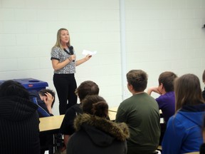 Emily Doer speaks to a group of Grade 7 and 8 students at Beaver Brae Secondary School on Friday, April 25, about her battle with eating disorders.