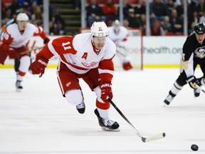 Detroit Red Wings right wing Daniel Alfredsson skates with the puck in overtime against the Pittsburgh Penguins at Joe Louis Arena earlier this season. Alfredsson's future in the NHL is now up in the air after being knocked out of the playoffs. Rick Osentoski-USA TODAY Sports